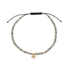 Faceted grey labradorite bracelet with an evil eye charm, small 9k gold accents and an adjustable black macramé closure