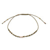 GOLDEN pyrite bracelet with 9k gold accents, crystal pavé bar and adjustable khaki cord on a white background.