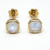 Close-up of moonstone stud earrings showing luminous stones, 9k gold settings, posts and earring backs.