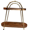 Decorative wall-mounted shelf with wooden slats and brass brackets on a white wall.